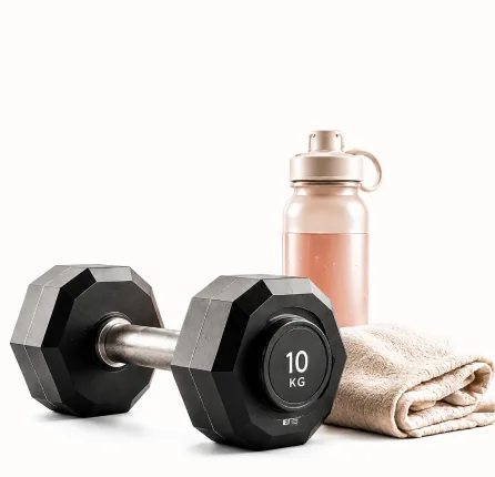 Dumbbell, water bottle and folded towel